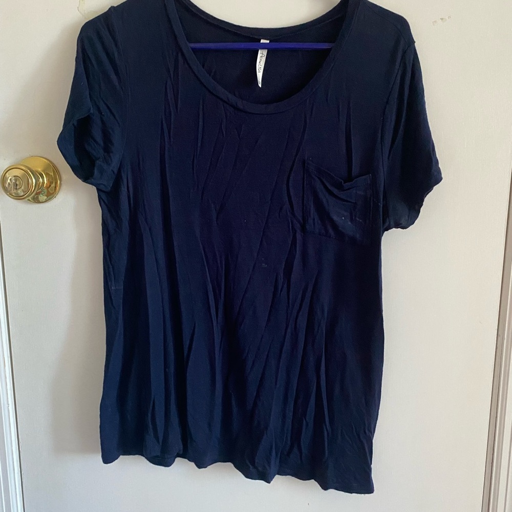 Navy blue short sleeve top. Has small stain but not bad as shown in picture